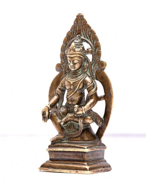 Kashmiri gilt bronze figure of seated Buddha with inlaid silver eyes, possibly 12th century 