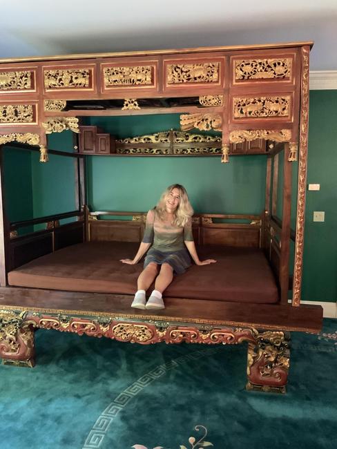 An auction standout is this over-the-top Chinese opium bed ($500-5,000) that is elaborately decorated and carved, measuring 100 inches tall.