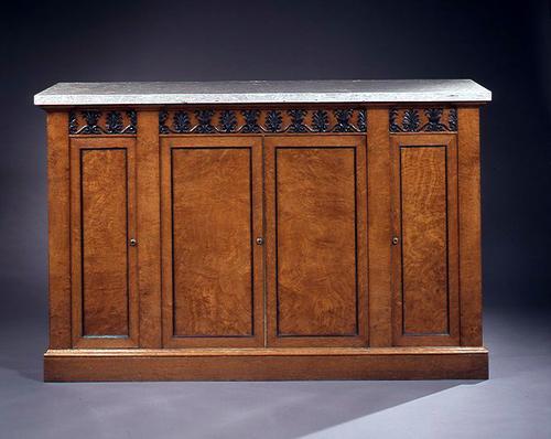 Regency pollard oak and parcel-ebonized side cabinet on a plinth base with fossil marble top (one of a pair)
Clinton Howell