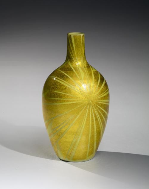 Ono Hakuko ( 1925 - 1996) Vase with radiating pattern, ca. 1987. G lazed porcelain with underglaze gold foil 9 1/2 x 5 1/8 in. Photo by Richard Goodbody. Exhibitor: Joan B Mirviss LTD