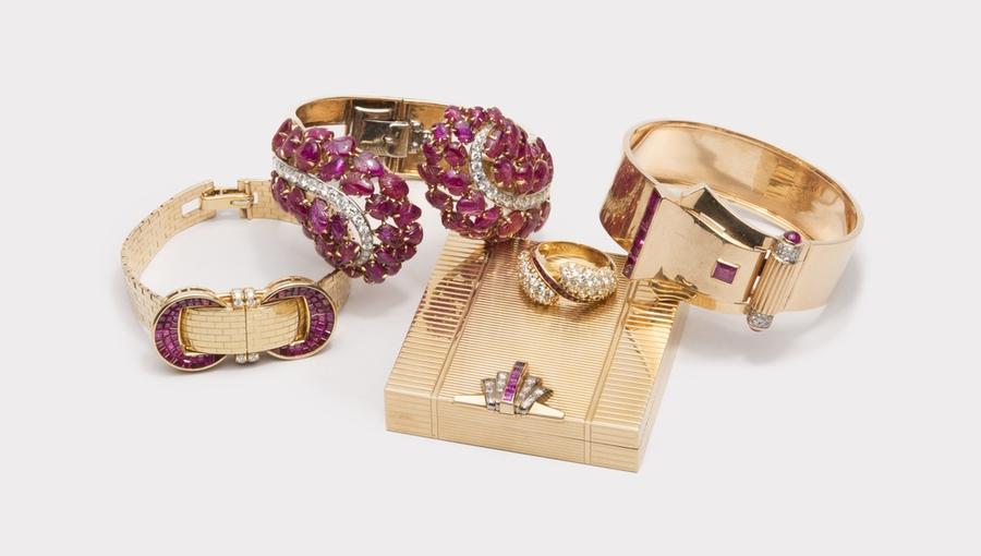 A selection of jewelry from The October Auction including a Van Cleef & Arpels covered wristwatch, a Boucheron carved ruby cuff bracelet, and a Raymond Yard compact.
Grogan & Company