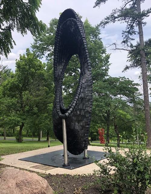 Chakaia Booker (b. 1953), United States, LBD Duty Free, 2014, reclaimed tires and stainless steel, Courtesy of the Artist, made possible through partnership with Pyramid Hill Sculpture Park & Museum