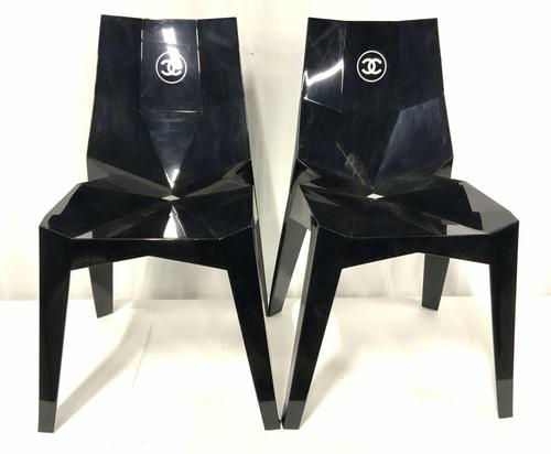 Also striking is this rare pair of Chanel boutique chairs ($500-2,000) made for exclusive use in photo shoots and bearing the iconic Chanel logo in white against a glossy black.